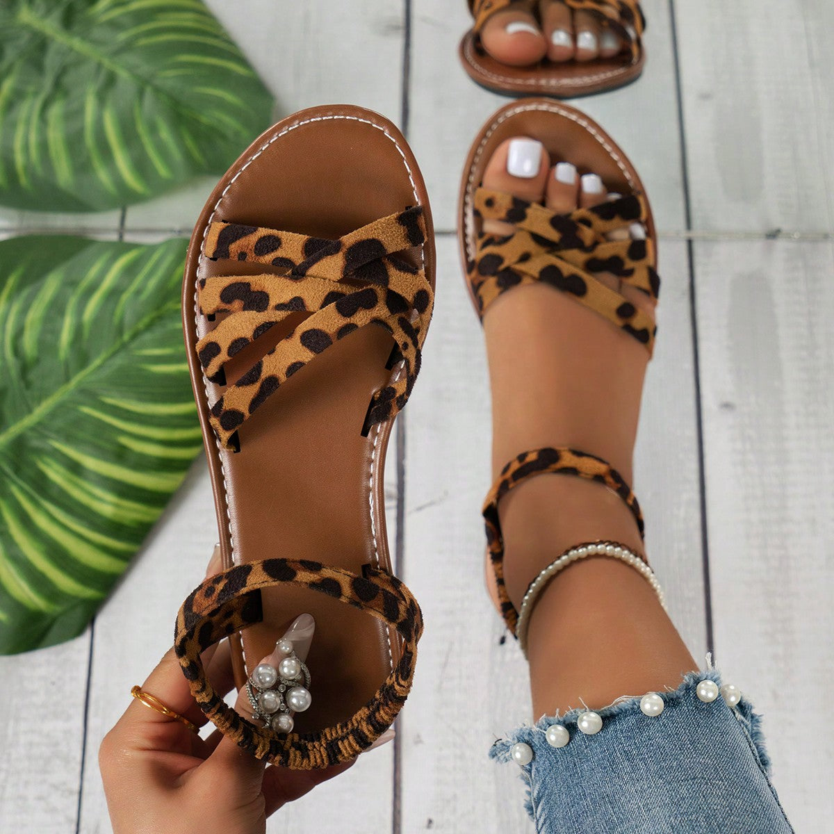 Women’s blue flat gladiator sandals with buckle and criss cross straps, round toe, and plaid pattern, styled as casual woven beach slippers.