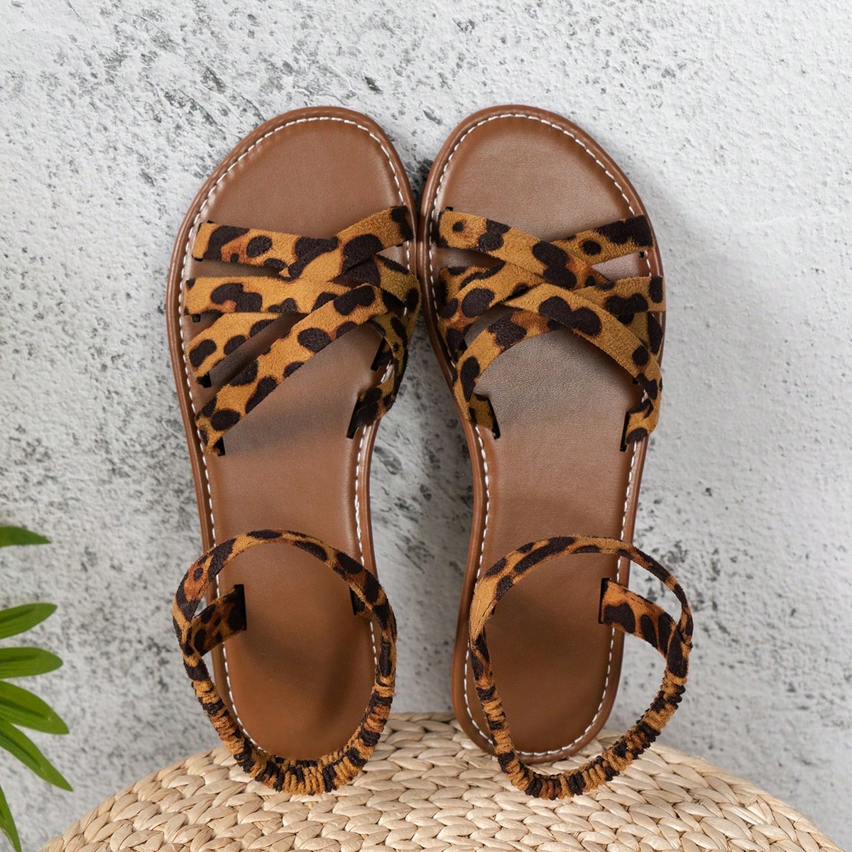 Women’s blue flat gladiator sandals with buckle and criss cross straps, round toe, and plaid pattern, styled as casual woven beach slippers.