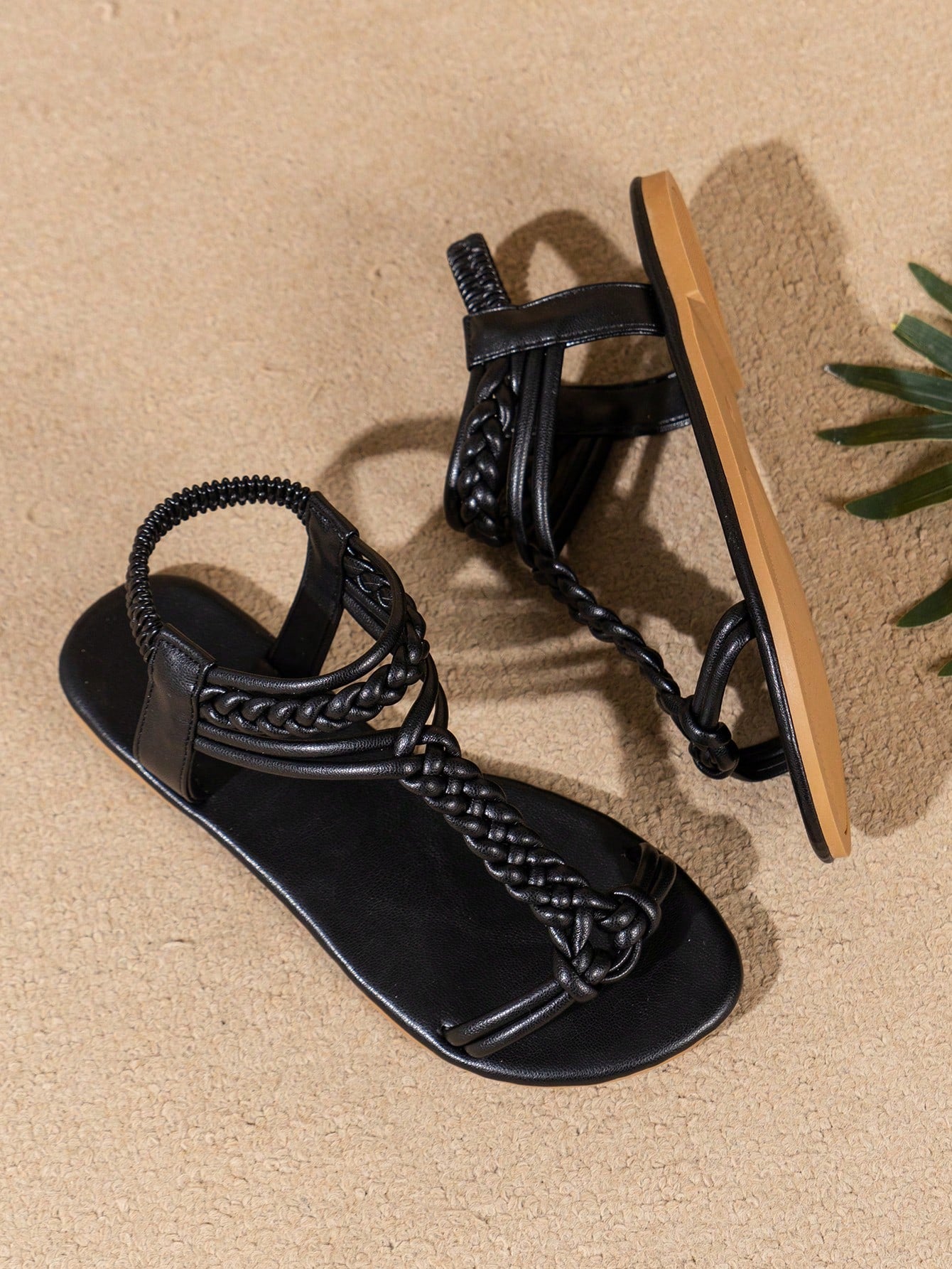 Women’s flat beach sandals with a woven braid band, toe-post thong front, and slingback strap, featuring a plain elegant style and rubber outsole.