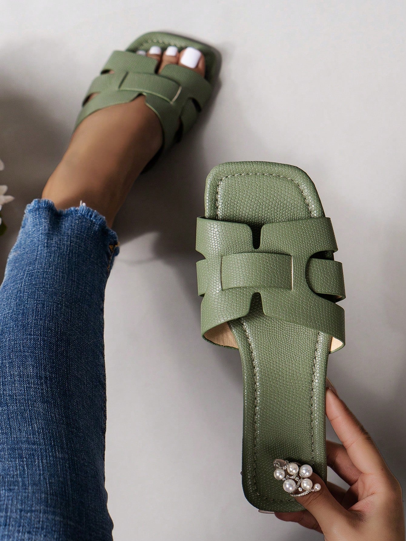 Women's Korean-style casual flat slide sandals with open toe, geometric detail, and pink color.