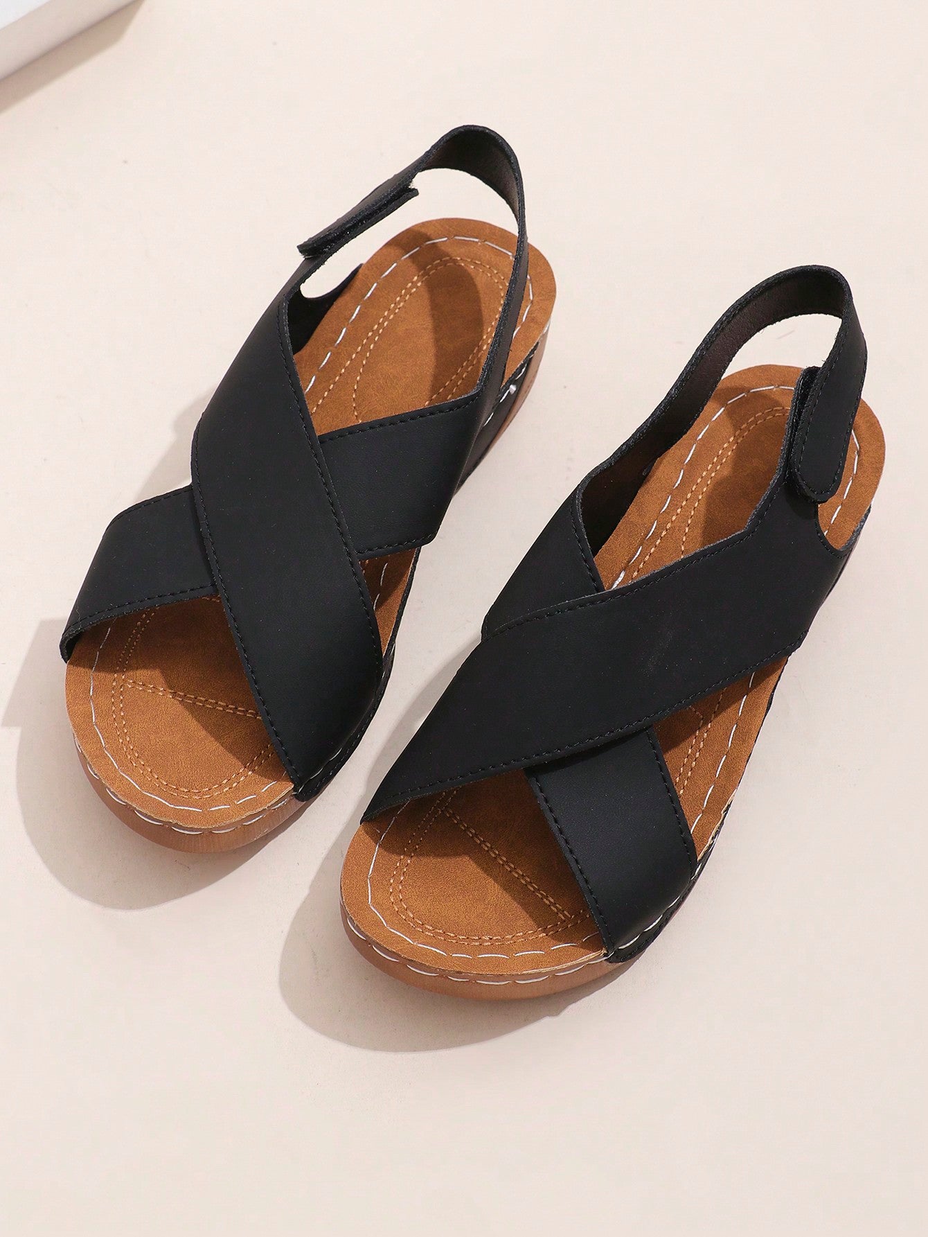 Women's open-toe wedge slide sandals with studded hollow-out upper, cross-over straps, buckle closure, and thick soft sole