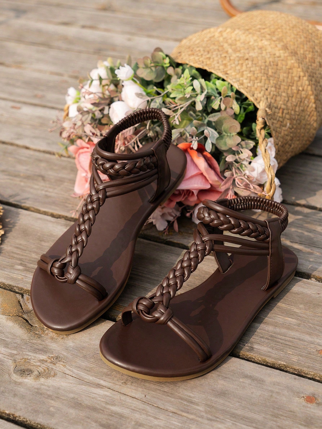 Women’s flat beach sandals with a woven braid band, toe-post thong front, and slingback strap, featuring a plain elegant style and rubber outsole.