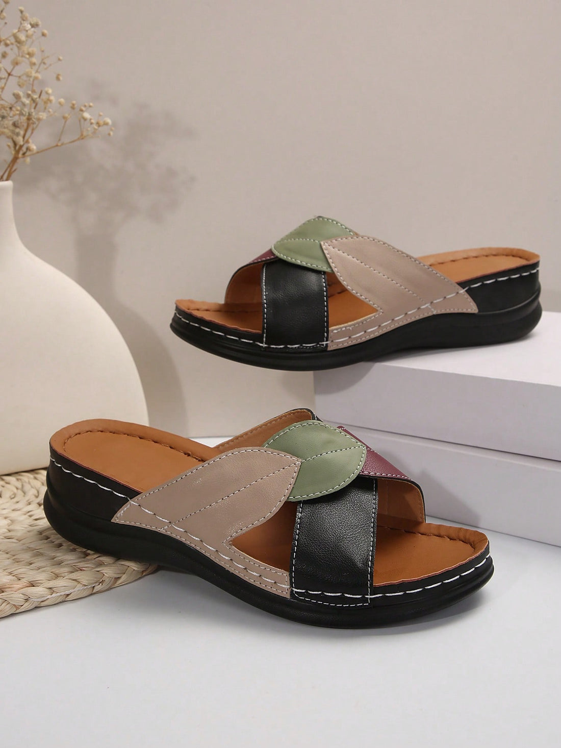 Women's multicolor wedge slide sandals with open toe, criss-cross straps, cut-out details, slip-on closure, and mid chunky wedge heel.