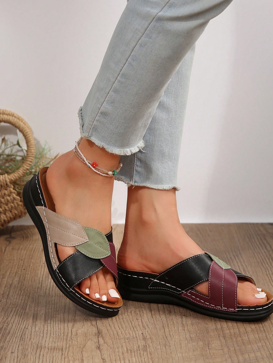 Women's multicolor wedge slide sandals with open toe, criss-cross straps, cut-out details, slip-on closure, and mid chunky wedge heel.