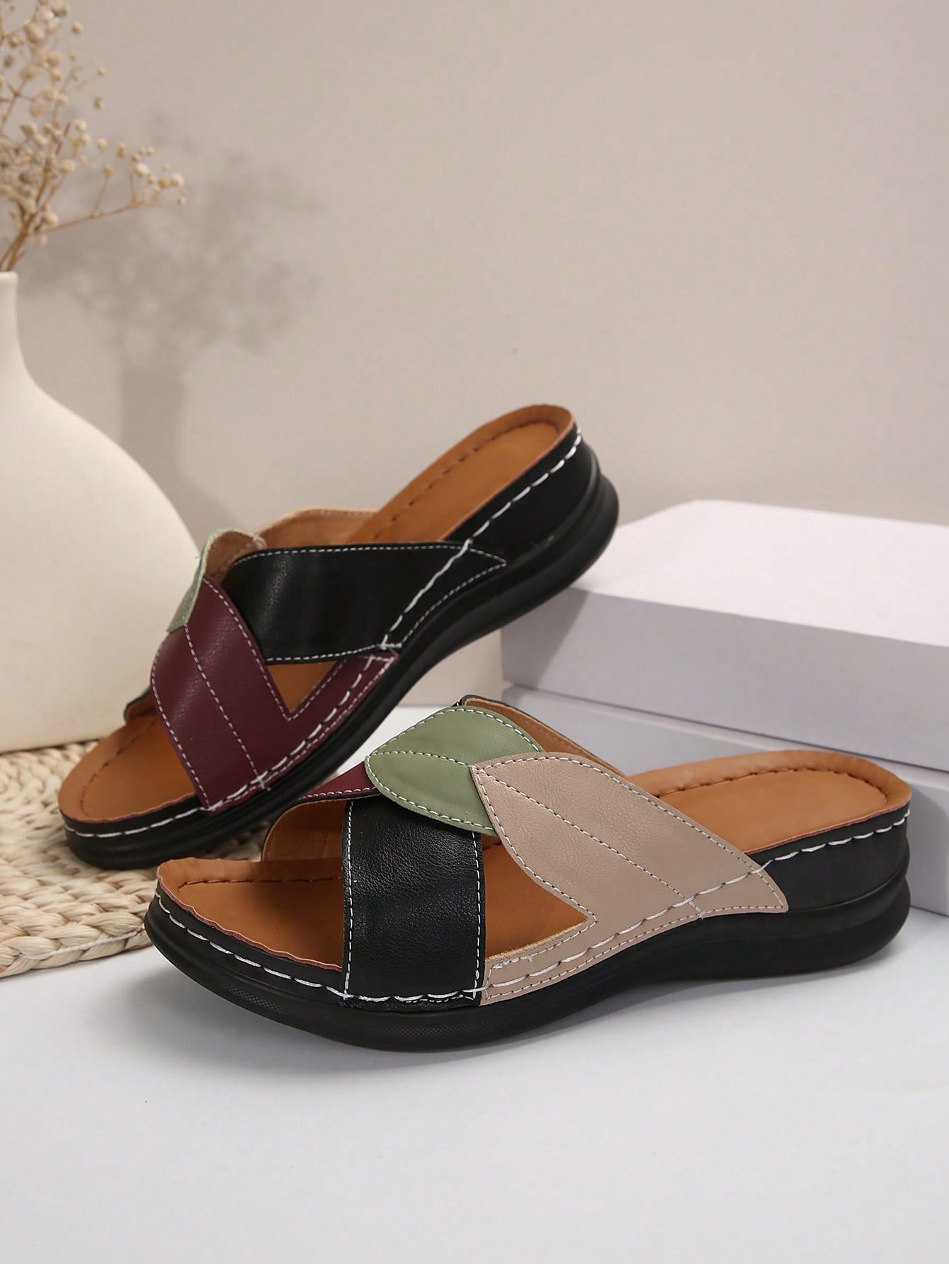 Women's multicolor wedge slide sandals with open toe, criss-cross straps, cut-out details, slip-on closure, and mid chunky wedge heel.
