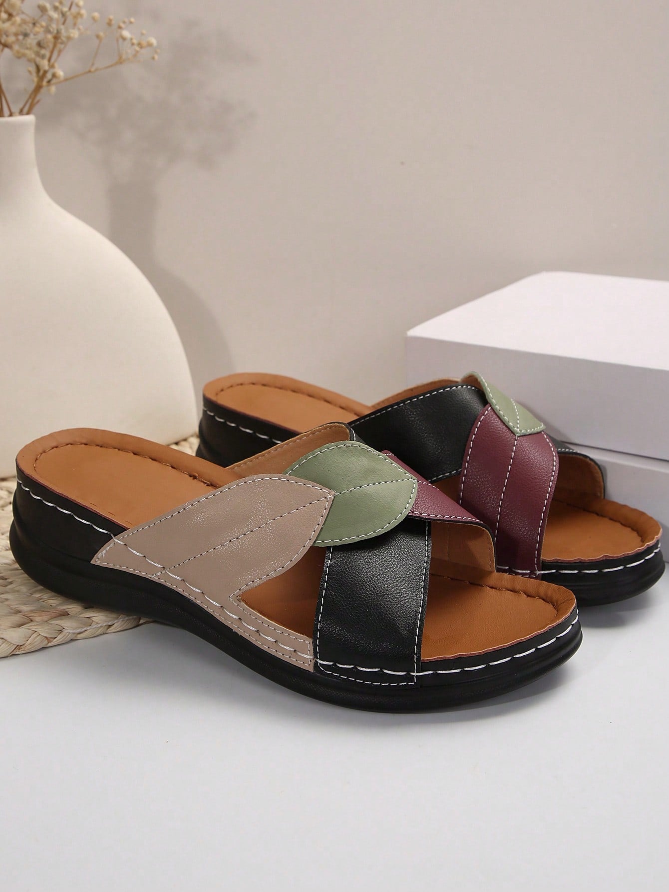 Women's multicolor wedge slide sandals with open toe, criss-cross straps, cut-out details, slip-on closure, and mid chunky wedge heel.