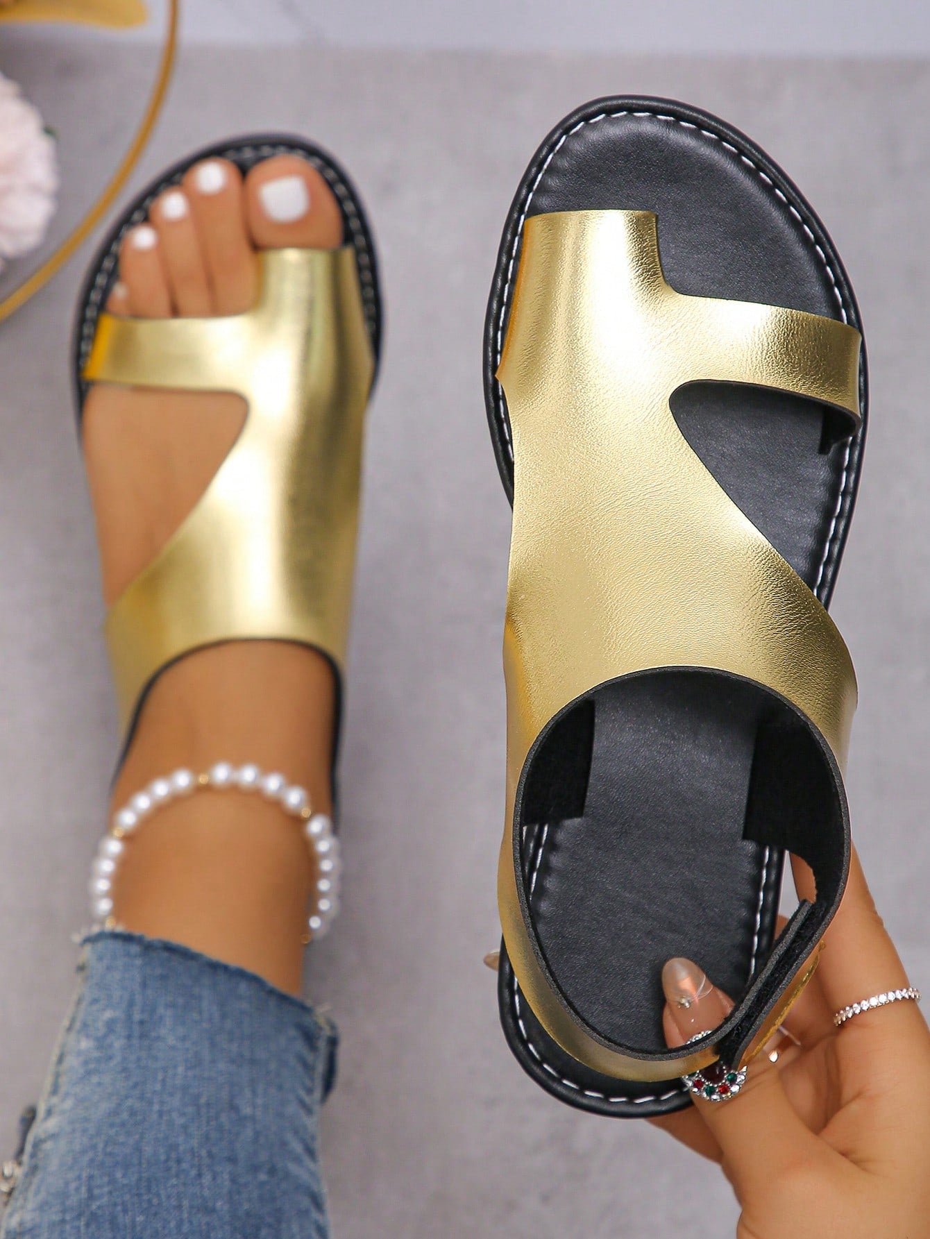 Women's flat slide sandals with toe ring toe-post design and hook-and-loop detail, suitable for summer outdoor wear.