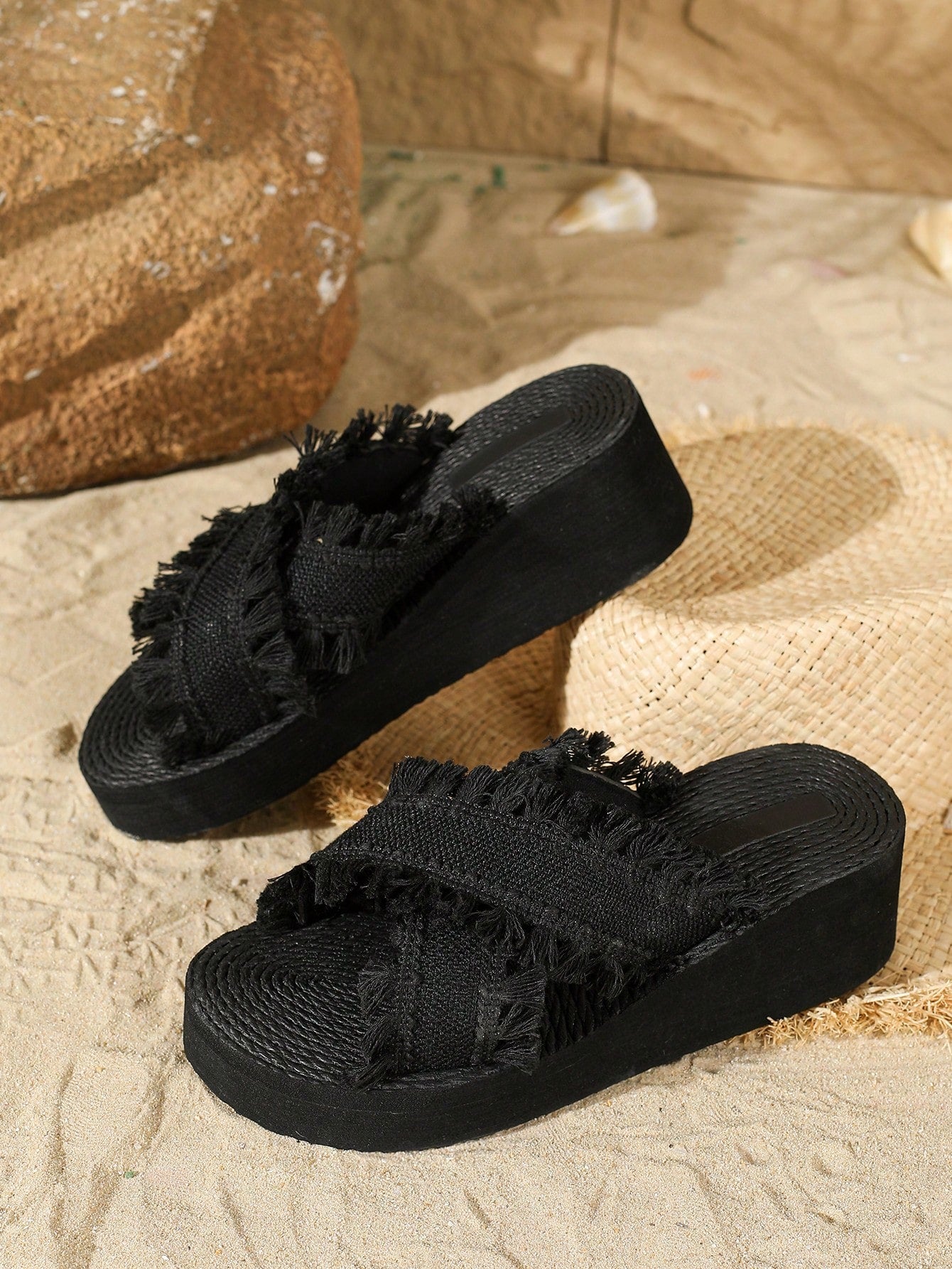 Women's beige slip-on platform wedge slide sandals with open toe, tassel and ruffle details, rope-pattern styling, and mid heel.