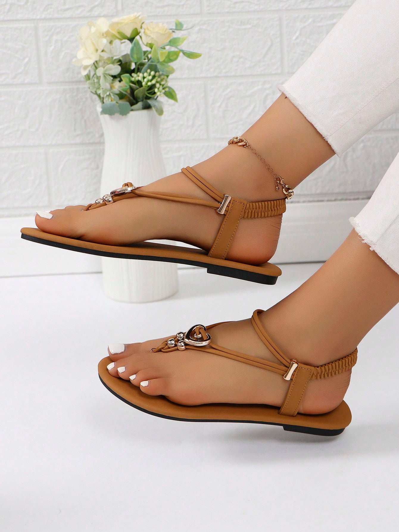 Women's slip-on flat gladiator sandals with beaded detail and toe post design