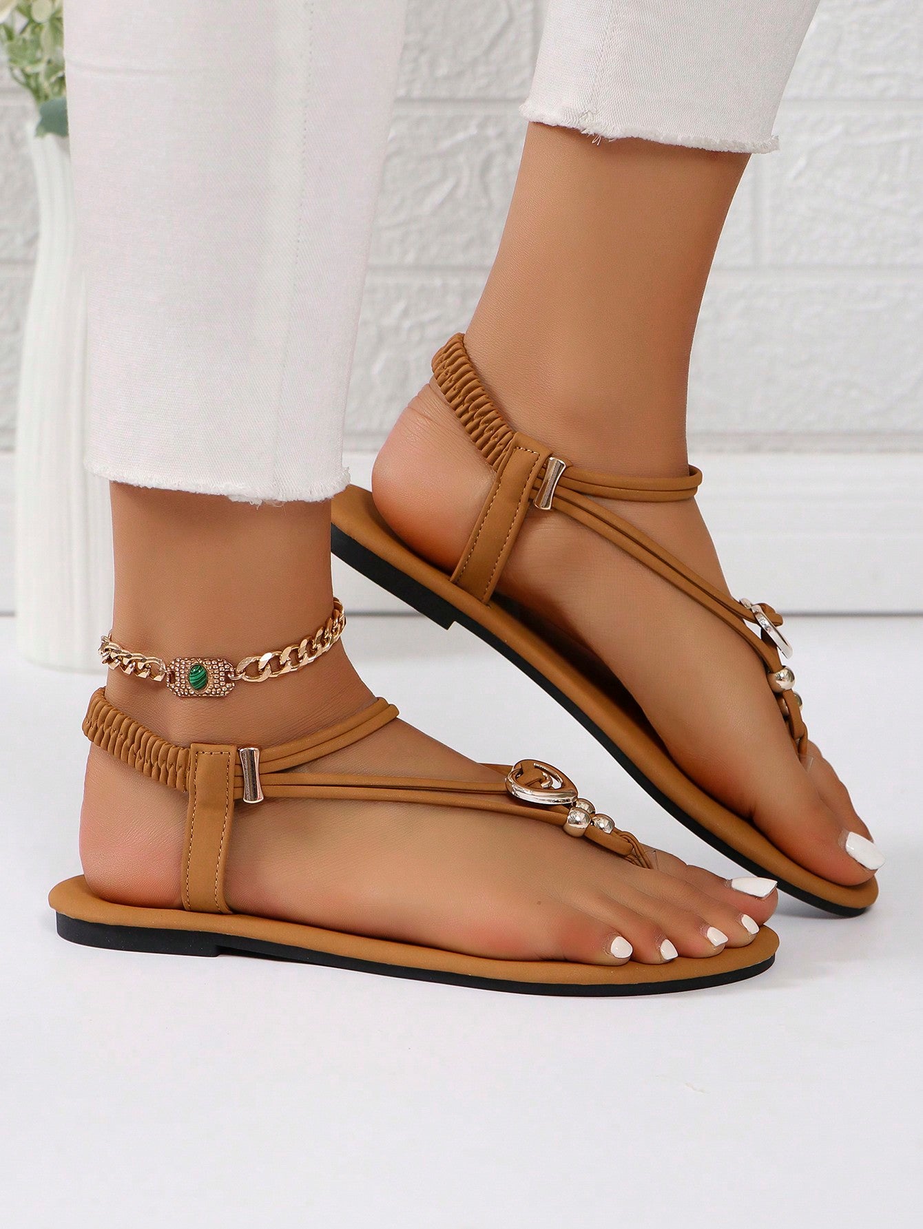 Women's slip-on flat gladiator sandals with beaded detail and toe post design
