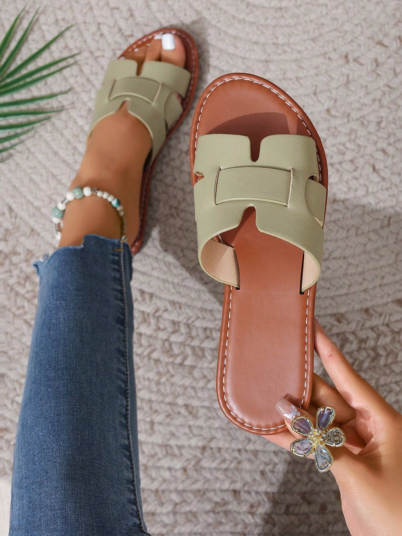 Women's open-toe flat slide sandals with slip-on design and metal decoration, suitable for outdoor casual summer wear.