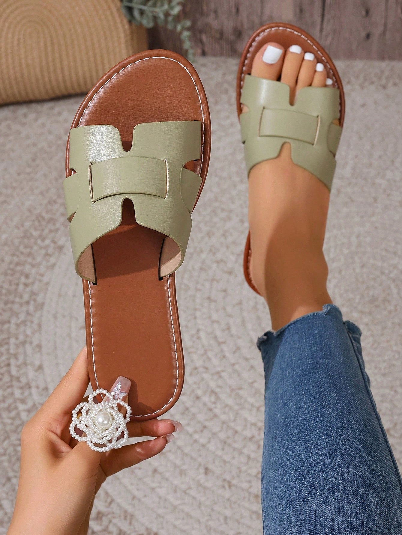 Women's open-toe flat slide sandals with slip-on design and metal decoration, suitable for outdoor casual summer wear.