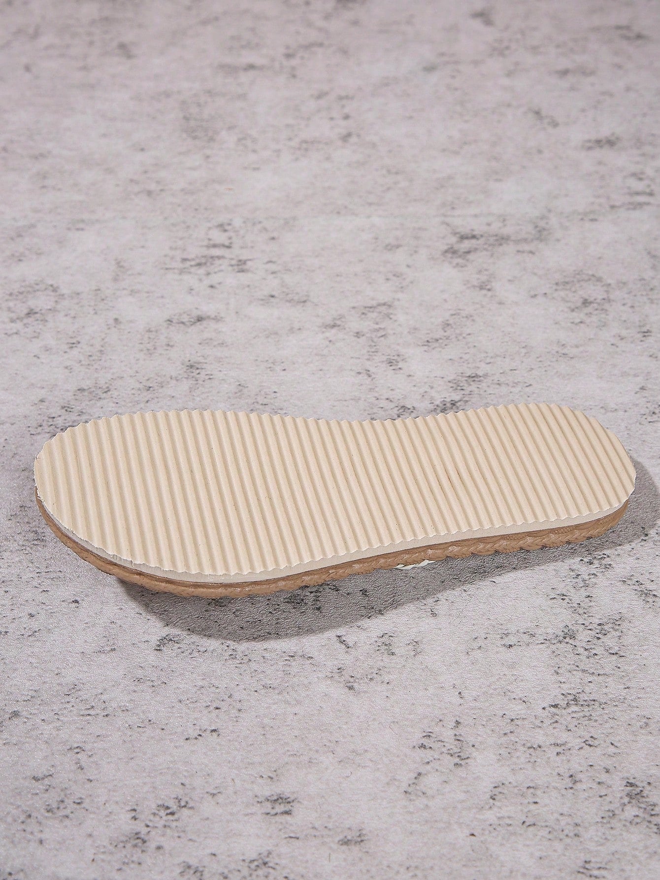 Women's braided flat thong sandals with toe post and slip-on slide design, suitable for casual outdoor and beach use.