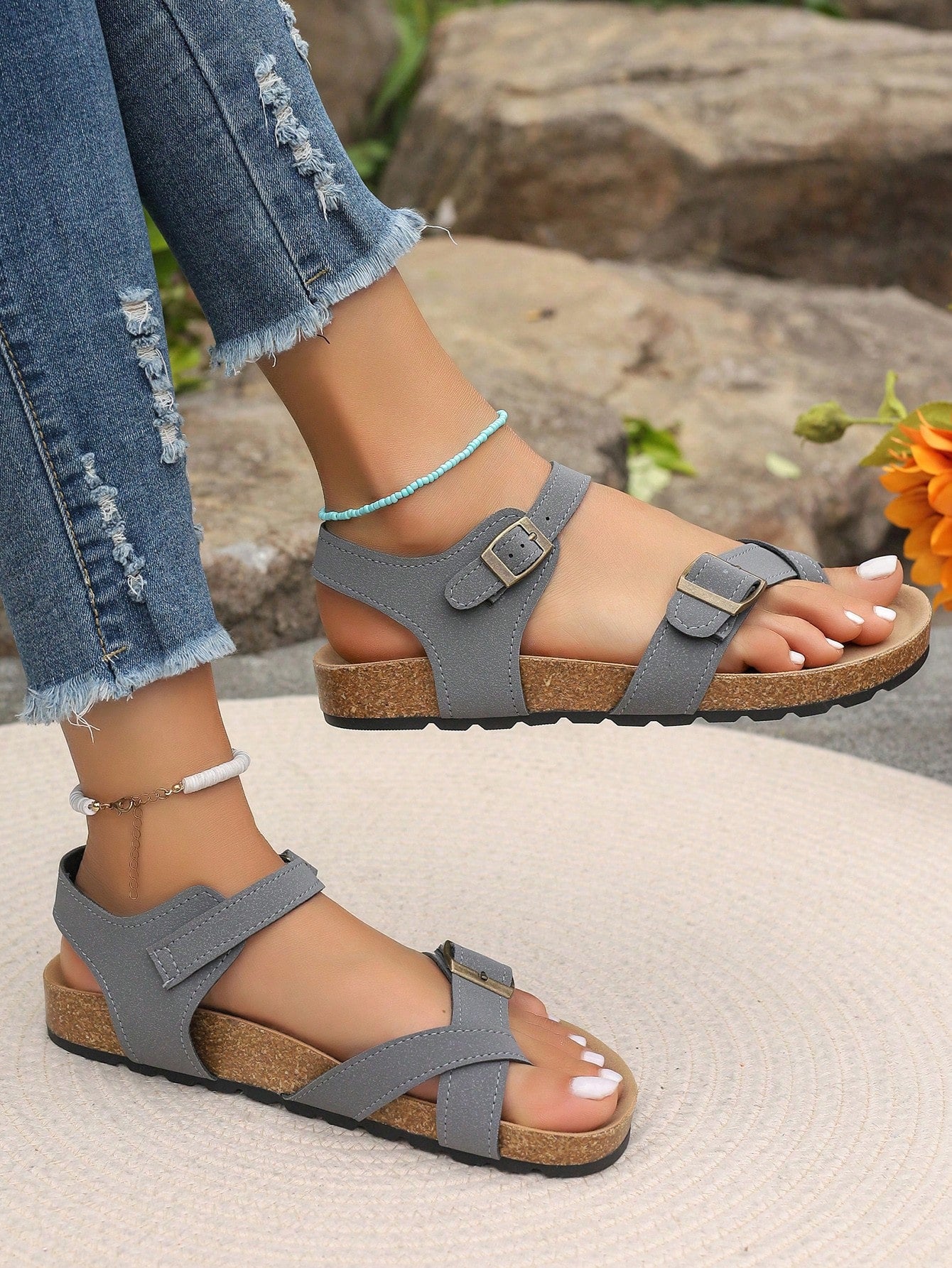 Women's plus size slip-on gladiator flat sandals with open toe and buckle detail, designed for beach and vacation wear.