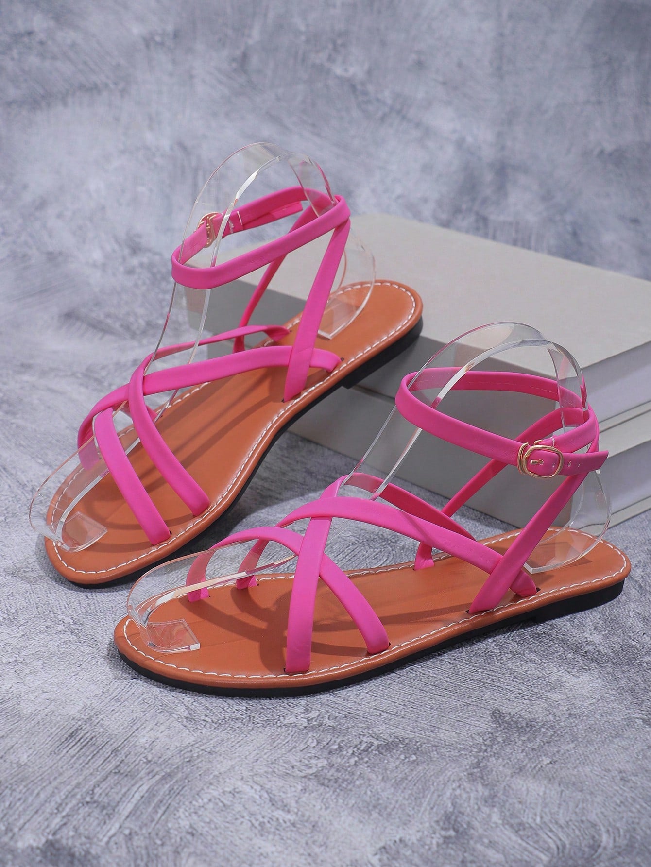 Women's flat open-toe slide sandals with criss cross straps and soft sole, styled for beach vacation outfits and dresses.