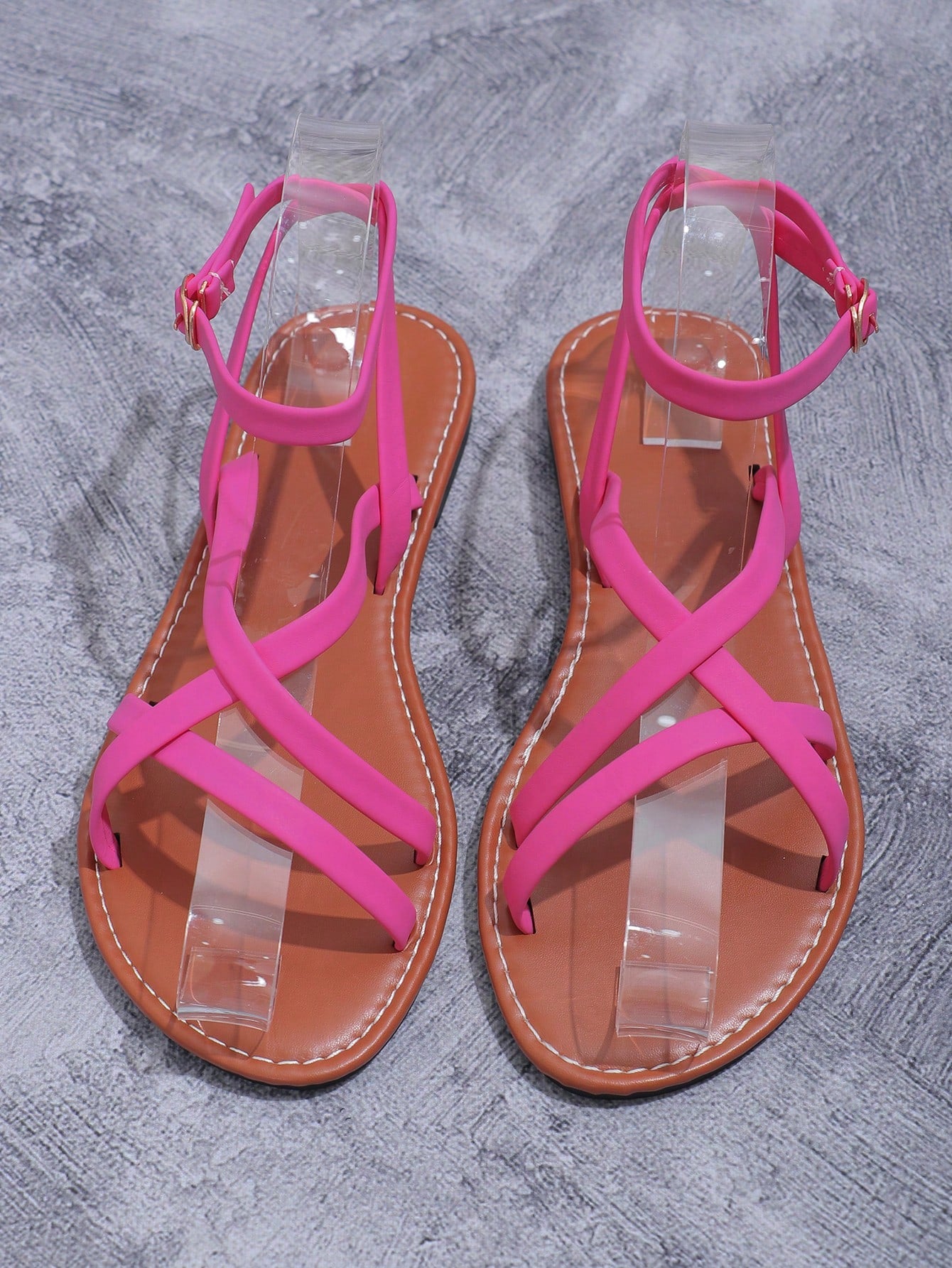 Women's flat open-toe slide sandals with criss cross straps and soft sole, styled for beach vacation outfits and dresses.