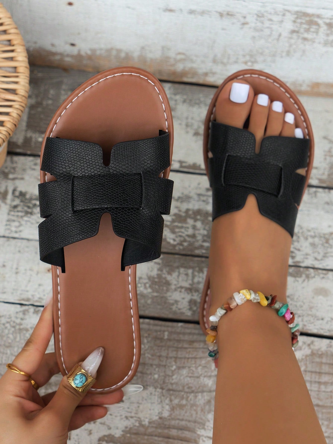 Women's open-toe flat slide sandals with slip-on design and metal decoration, suitable for outdoor casual summer wear.