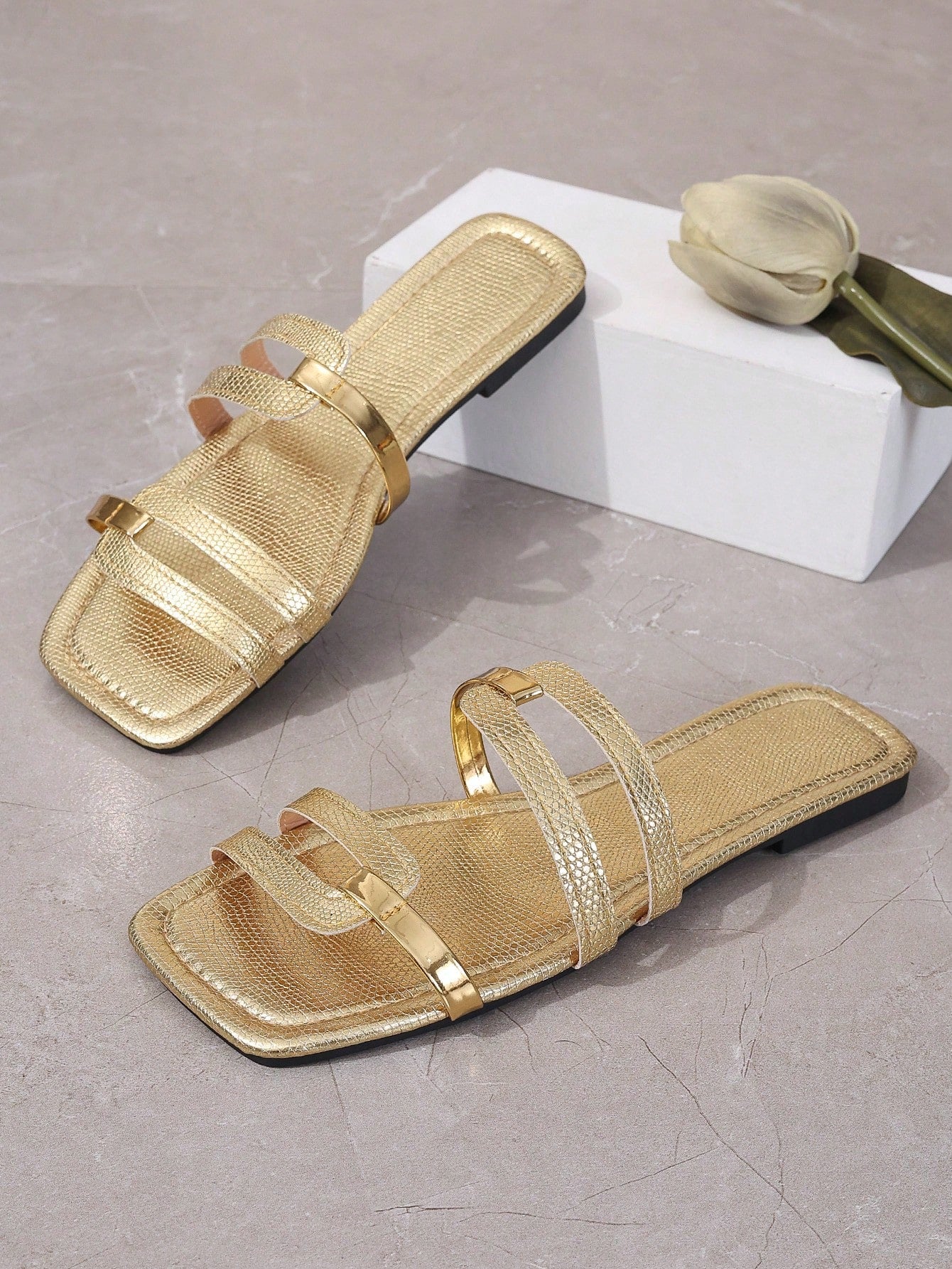 Women's yellow open-toe flat slide sandals featuring a cut-out design and textured plain pattern for casual beach and daily wear.