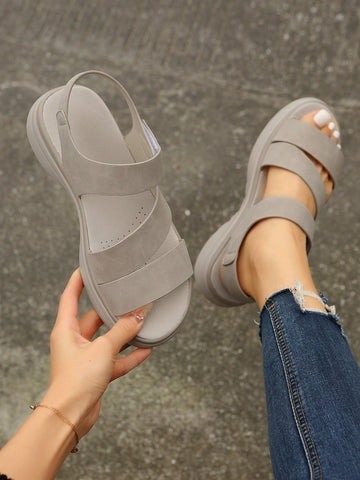 Women's plus size platform wedge sandals with hook-and-loop closure, open toe, ankle strap, and cut-out detailing in a casual beach style.