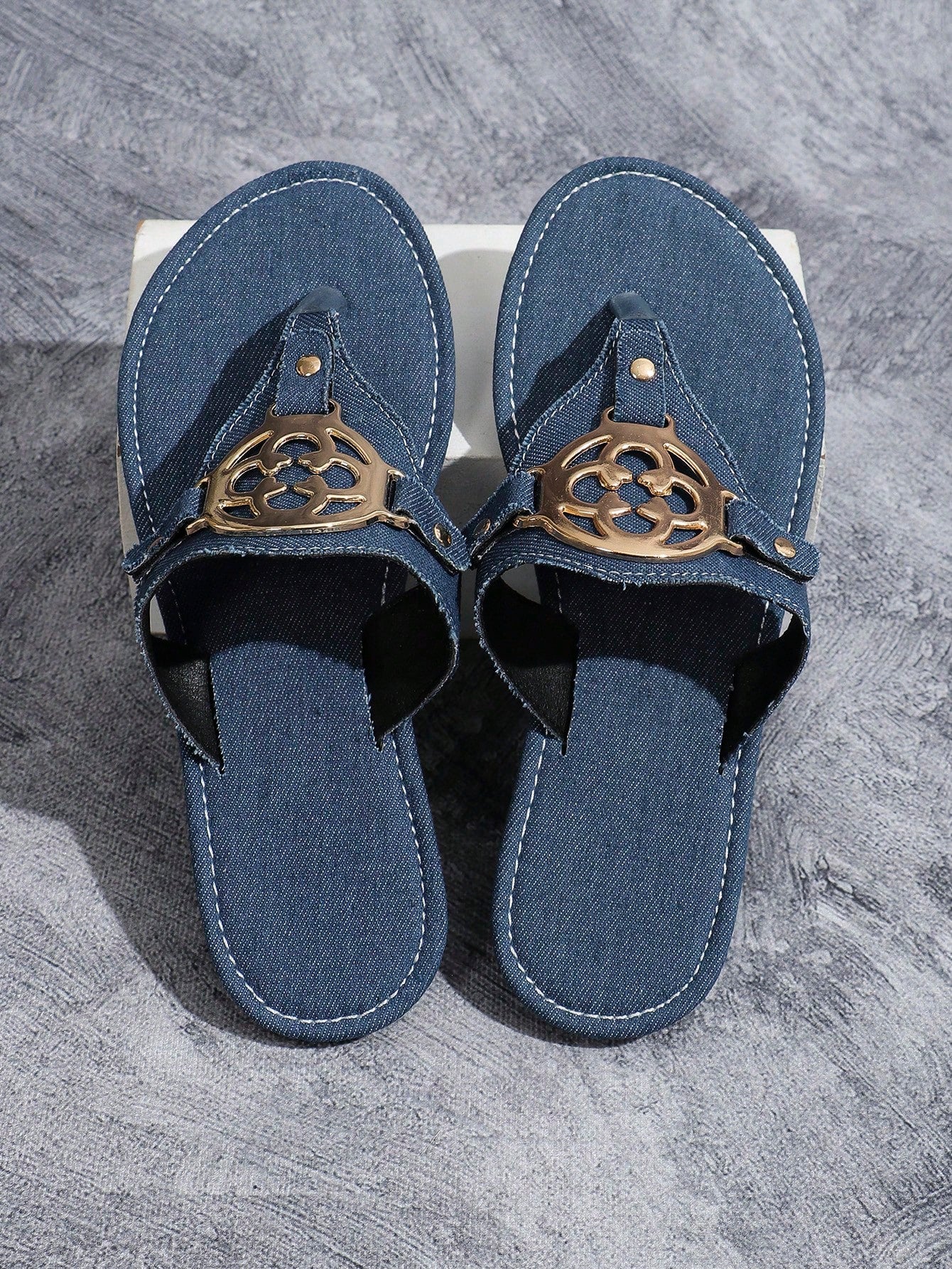 Women's blue flat slide sandals with camouflage butterfly embroidery, round buckle detail, open toe toe-post design, and slip-resistant outsole for indoor and outdoor wear.