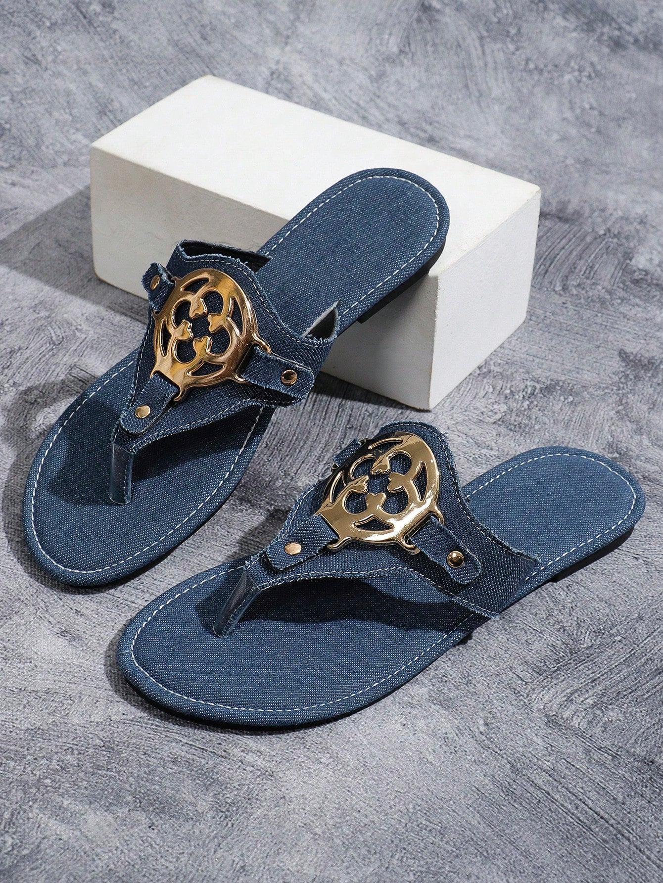 Women's blue flat slide sandals with camouflage butterfly embroidery, round buckle detail, open toe toe-post design, and slip-resistant outsole for indoor and outdoor wear.