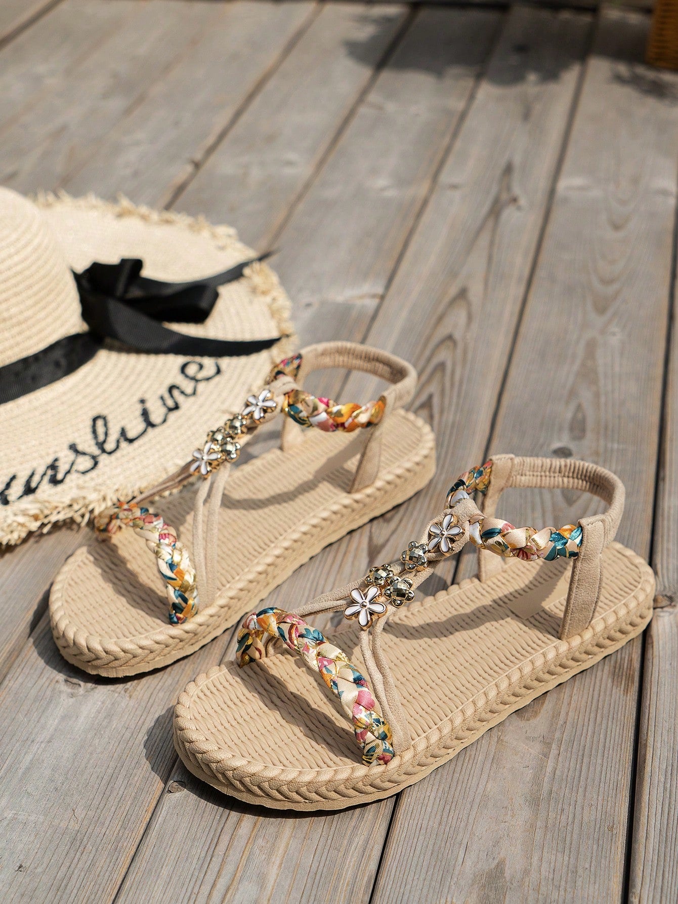 Women's woven flat slip-on sandals with beaded detail, open toe design, and multicolor tropical colorblock printed pattern for beach and summer wear.