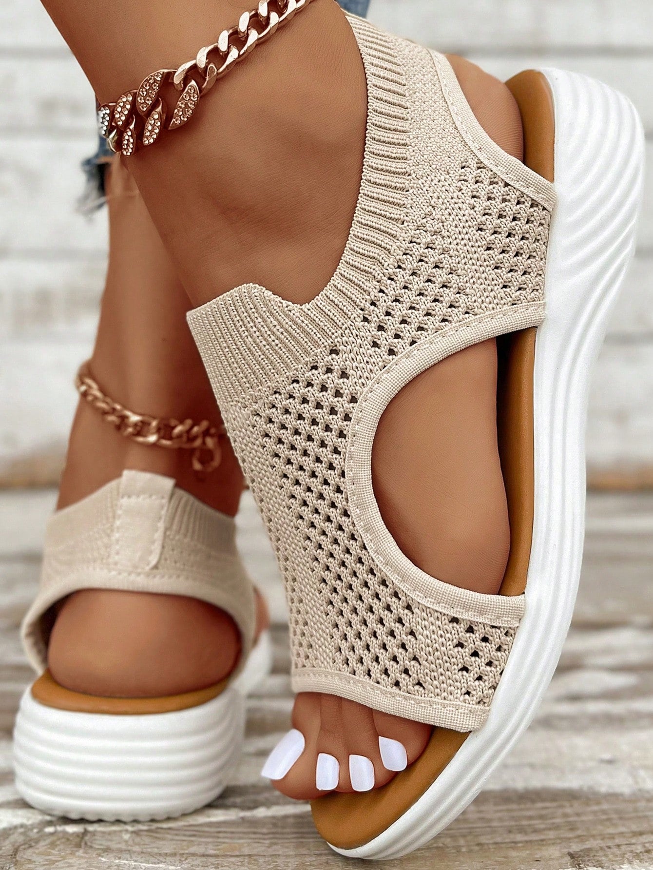 Plus size women's slip-on wedge slide sandals with open toe, low platform heel, and breathable cutout fabric upper, shown as a casual outdoor style sandal.