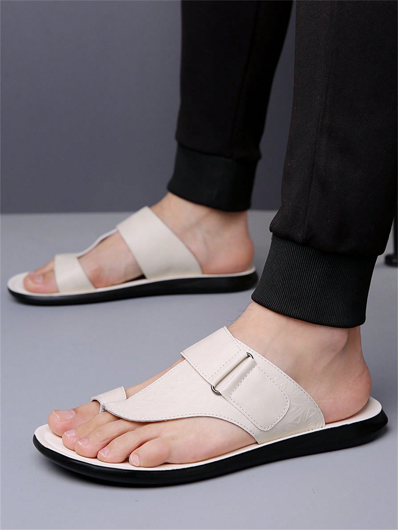 Men's summer beach slippers featuring a toe post, hook-and-loop detail, soft molded sole, and anti-skid outsole for casual outdoor wear.