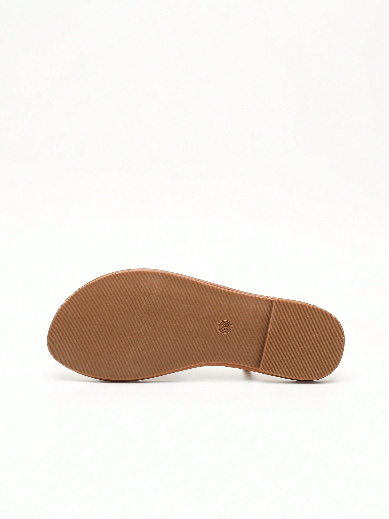 Women's slip-on flat sandals featuring round toe styling, a toe post, metal strap detail, and buckle accent, designed for casual beach and warm-weather outfits.