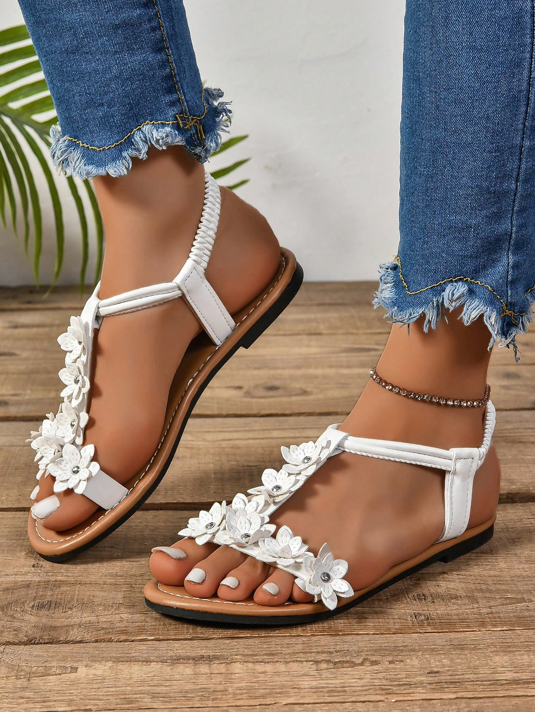 Women's bohemian flat slide sandals with embroidered applique detailing and open-toe design, suitable for casual beach and vacation wear.
