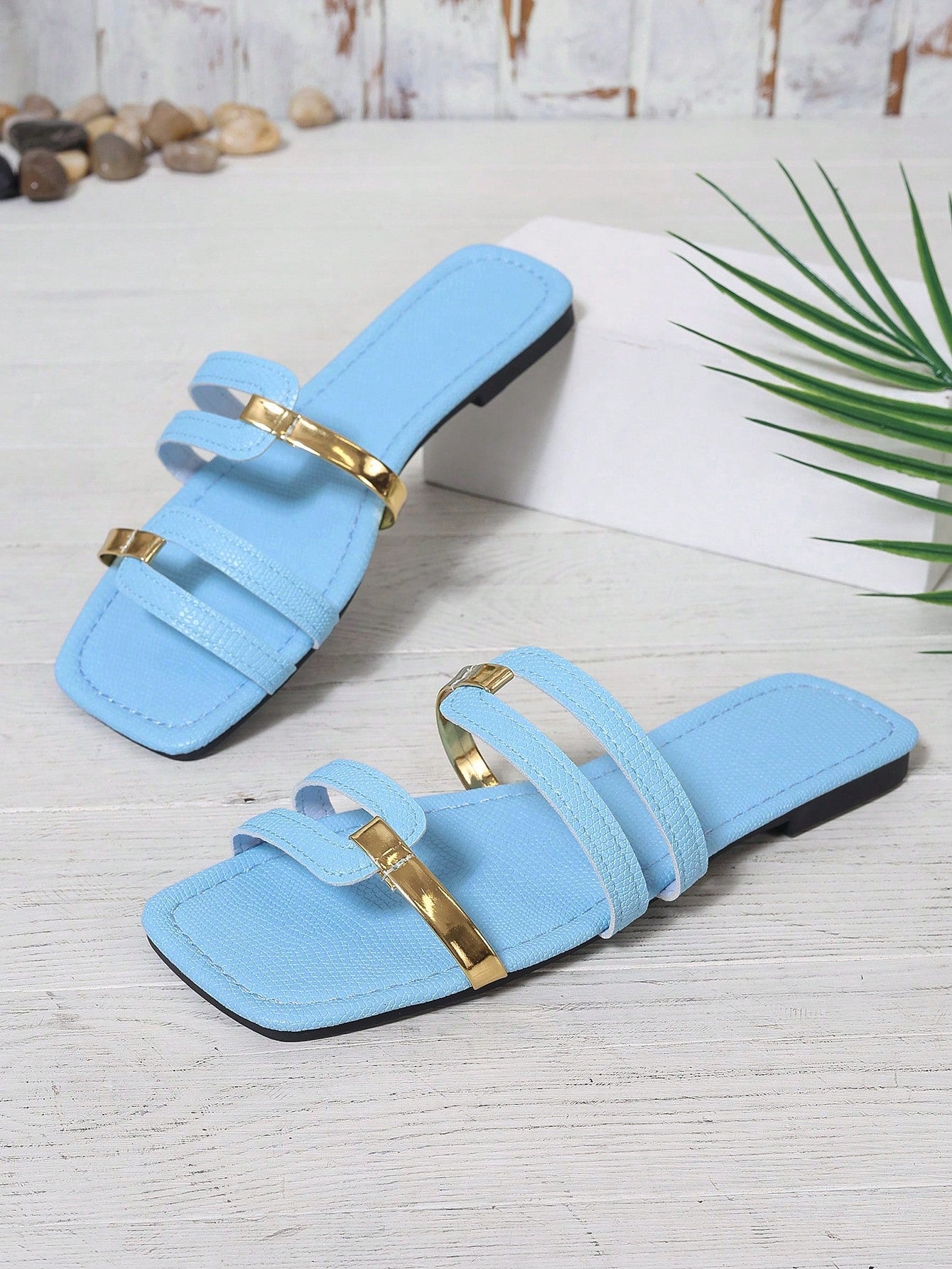 Women's yellow open-toe flat slide sandals featuring a cut-out design and textured plain pattern for casual beach and daily wear.