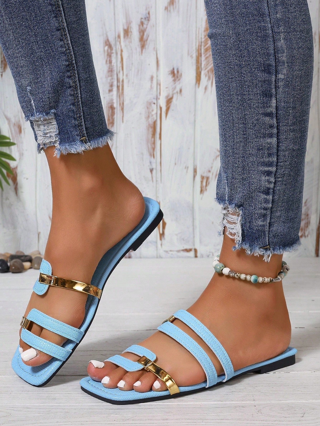 Women's yellow open-toe flat slide sandals featuring a cut-out design and textured plain pattern for casual beach and daily wear.