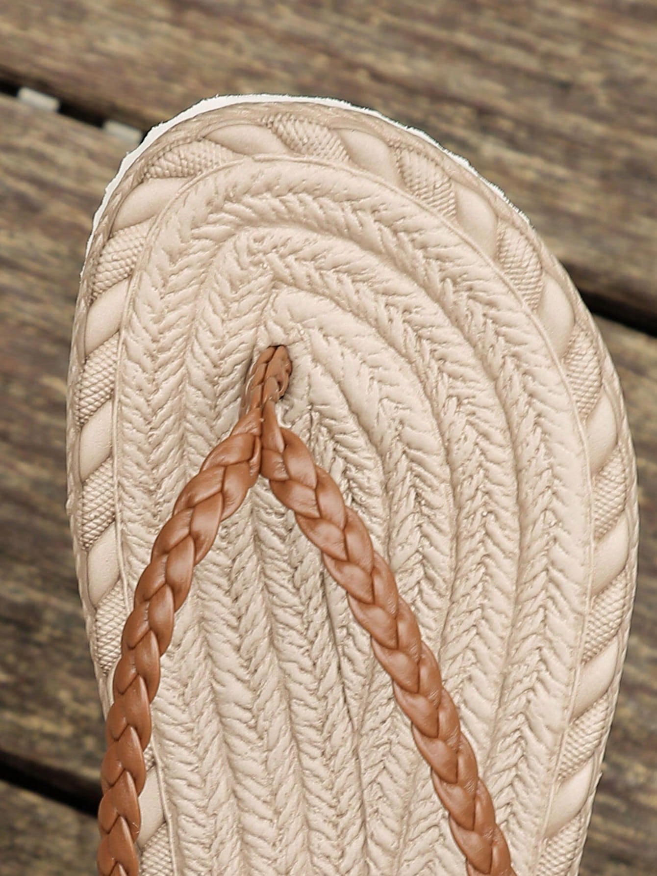Women's braided flat thong sandals with toe post and slip-on slide design, suitable for casual outdoor and beach use.