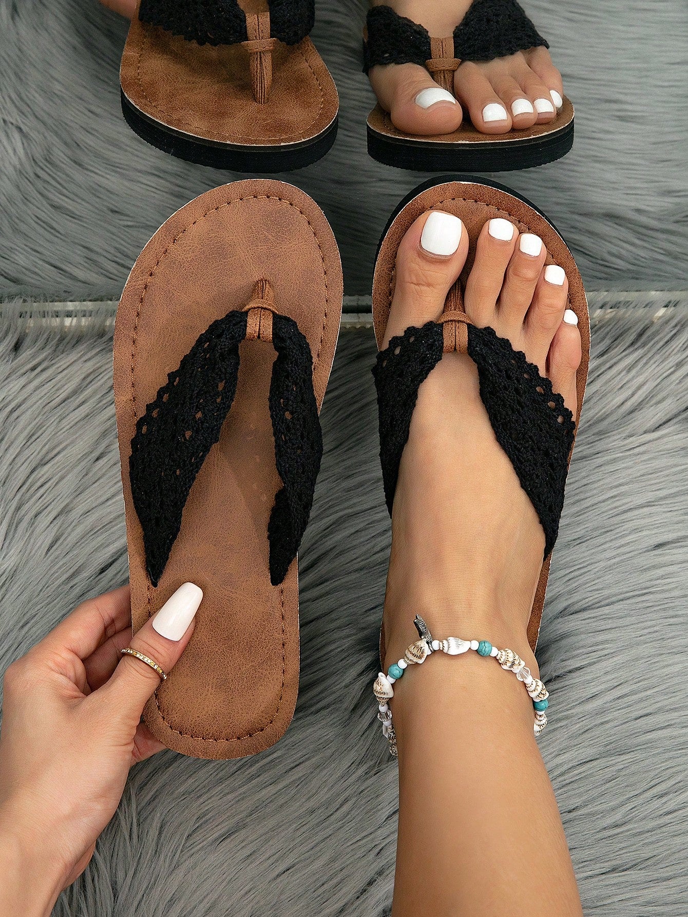 Women's flat lace slide sandals with an open-toe, hollow breathable upper and lightweight beach slipper design.