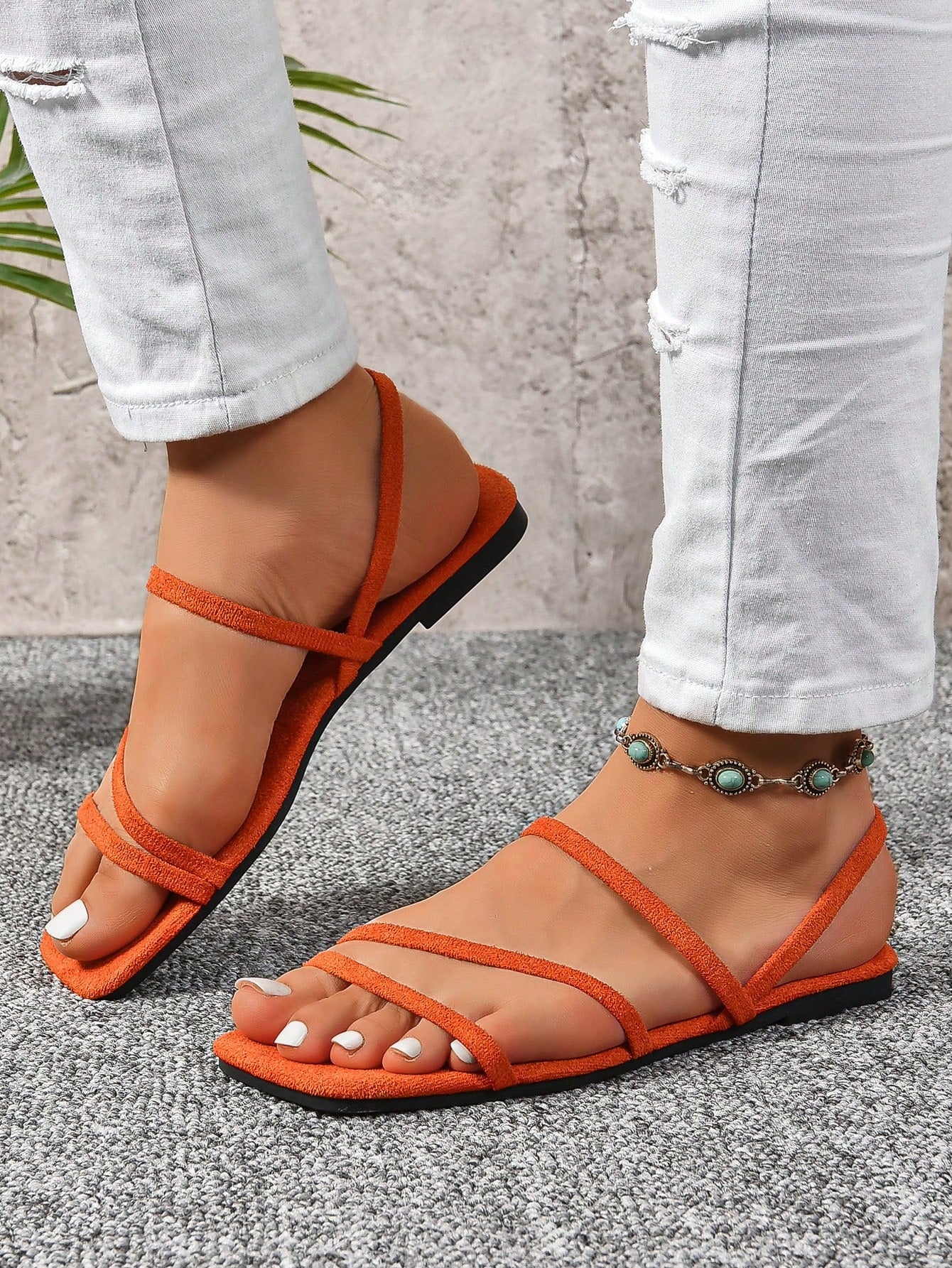 Women's flat sandals with a square open toe, crisscross front straps, and an elastic ankle strap, suitable for casual summer outdoor and beach vacation wear.