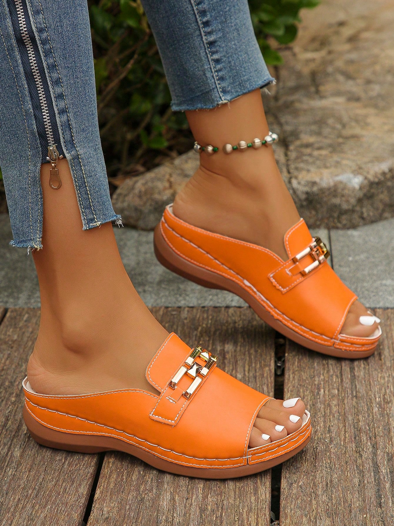 Women's bohemian wedge slide sandals with open toe, low wedge heel, slip-on design, and metal detail, available in plus sizes 36-43.