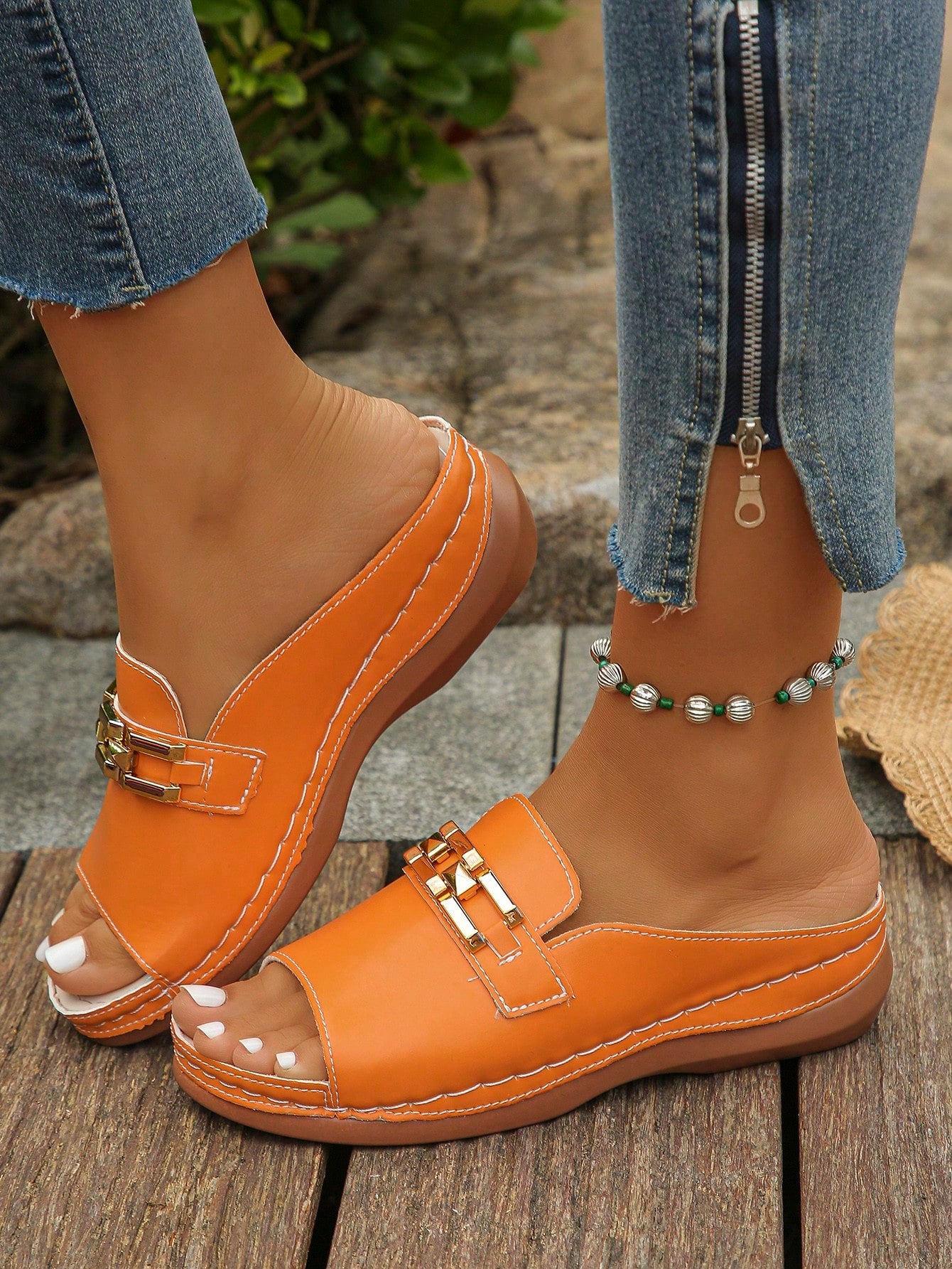 Women's bohemian wedge slide sandals with open toe, low wedge heel, slip-on design, and metal detail, available in plus sizes 36-43.