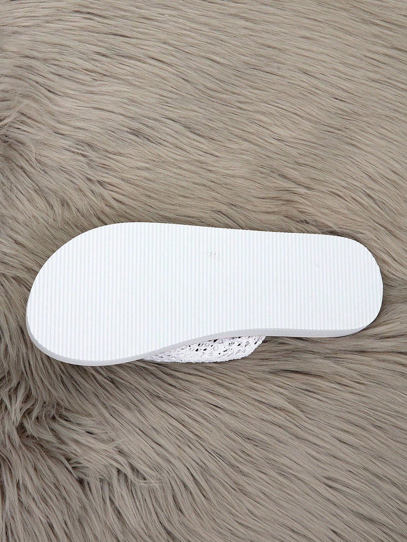 Women's flat lace slide sandals with an open-toe, hollow breathable upper and lightweight beach slipper design.