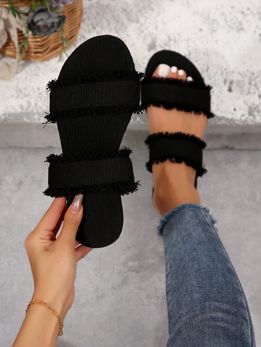 Black women's flat slide sandals with open toe design, decorated with pearl and rhinestone details.