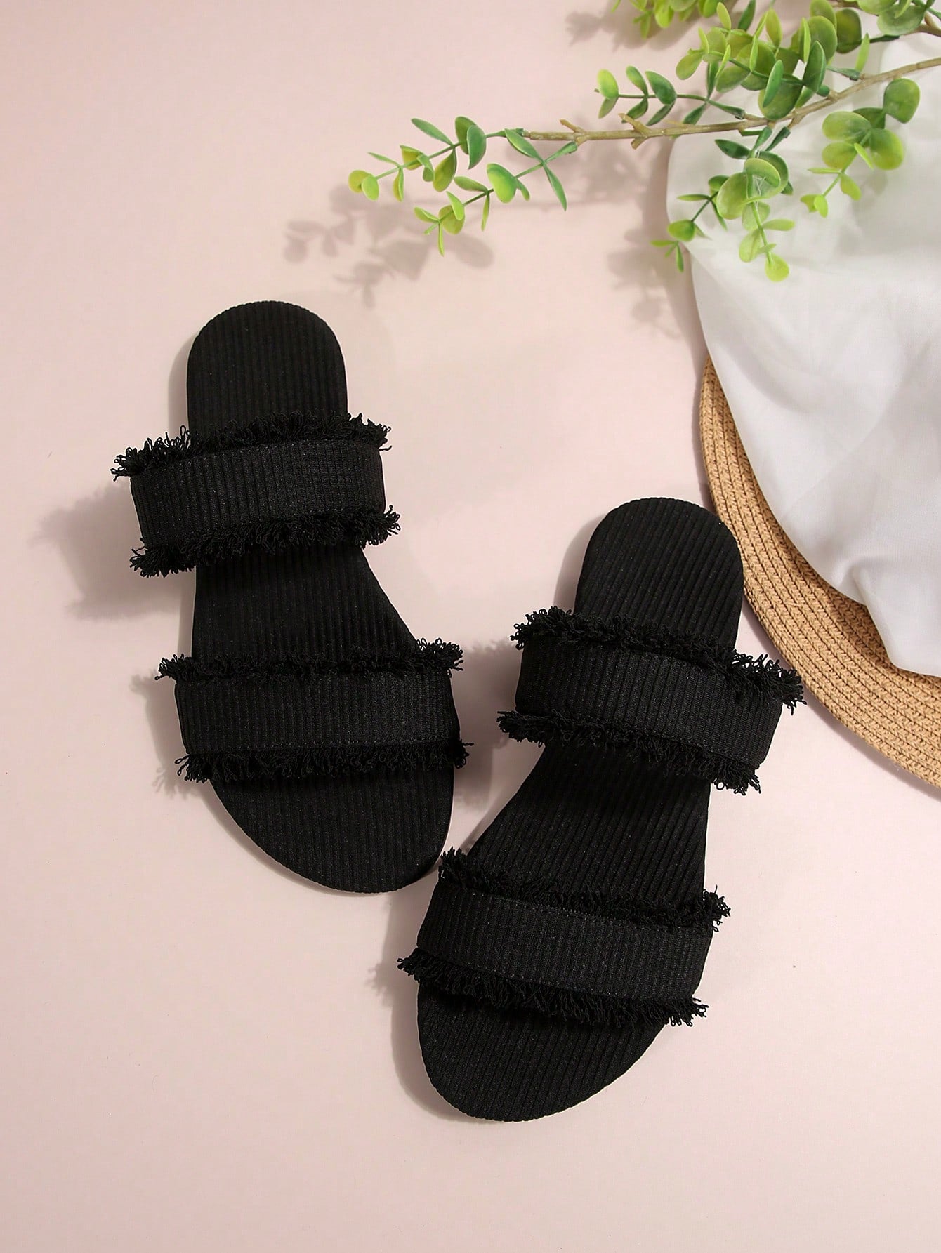 Black women's flat slide sandals with open toe design, decorated with pearl and rhinestone details.