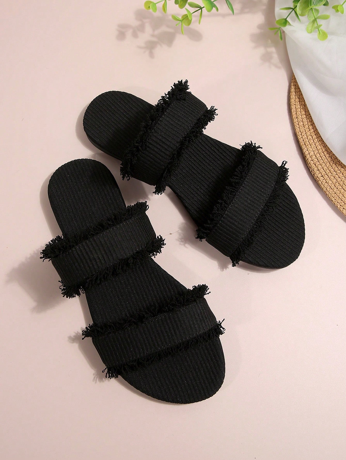 Black women's flat slide sandals with open toe design, decorated with pearl and rhinestone details.