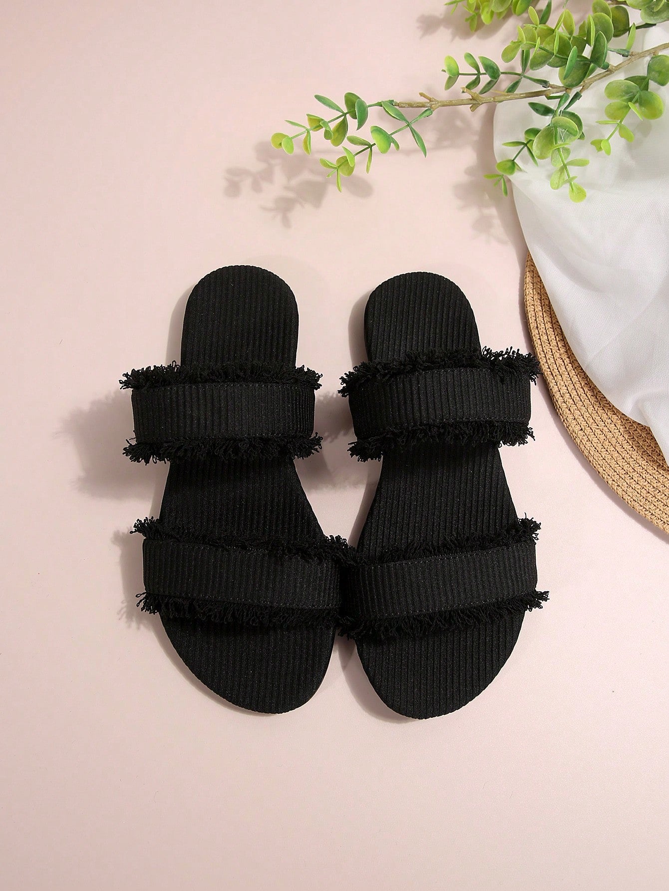 Black women's flat slide sandals with open toe design, decorated with pearl and rhinestone details.