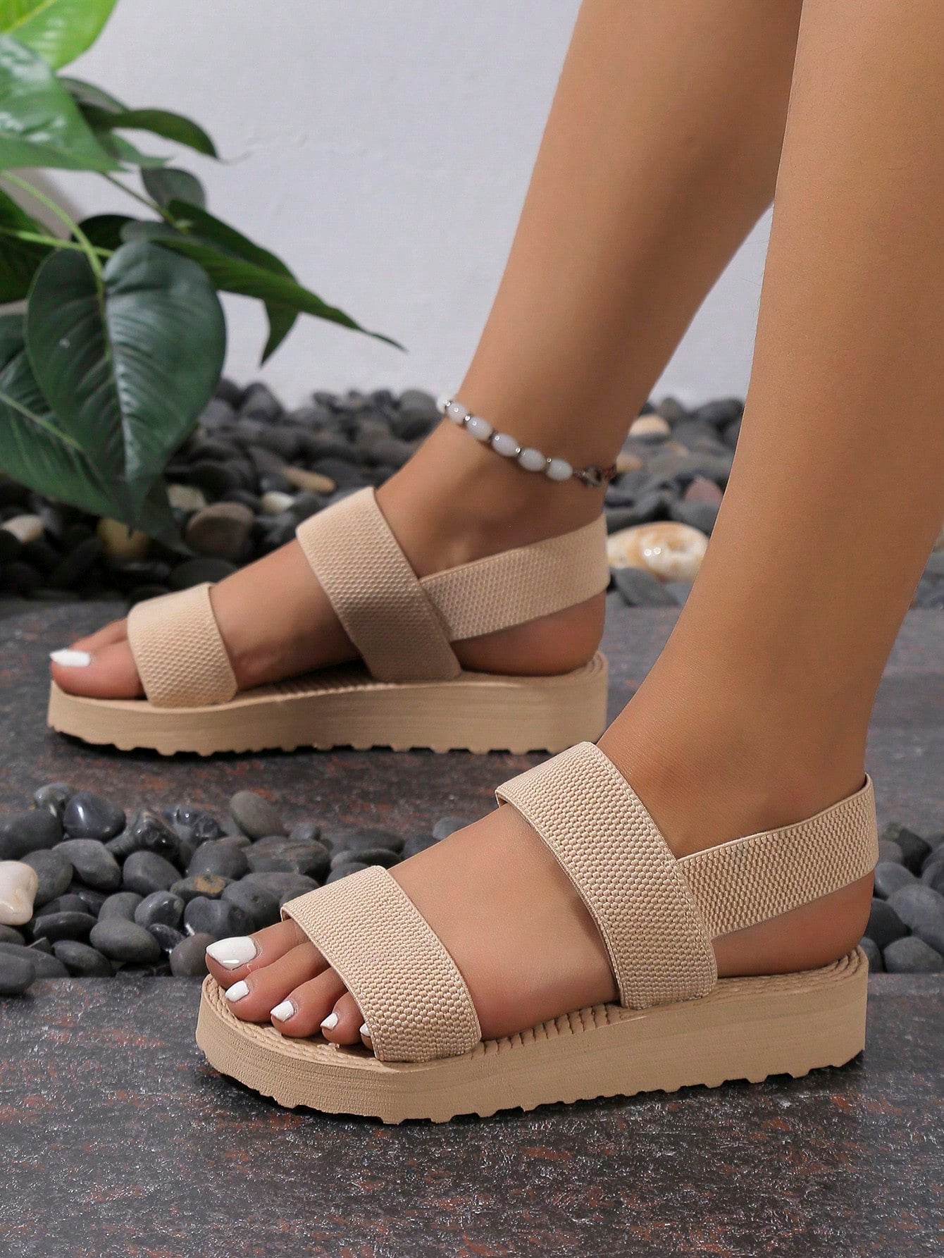 Women's minimalist double strap slingback wedge sandals with open toe and slip-on design.