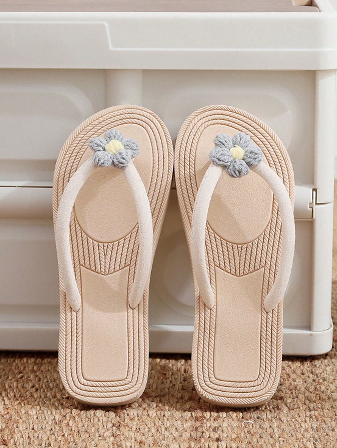 Women's casual flat thong flip flop sandals with minimalist design and applique detail, suitable for outdoor and beach holiday wear.
