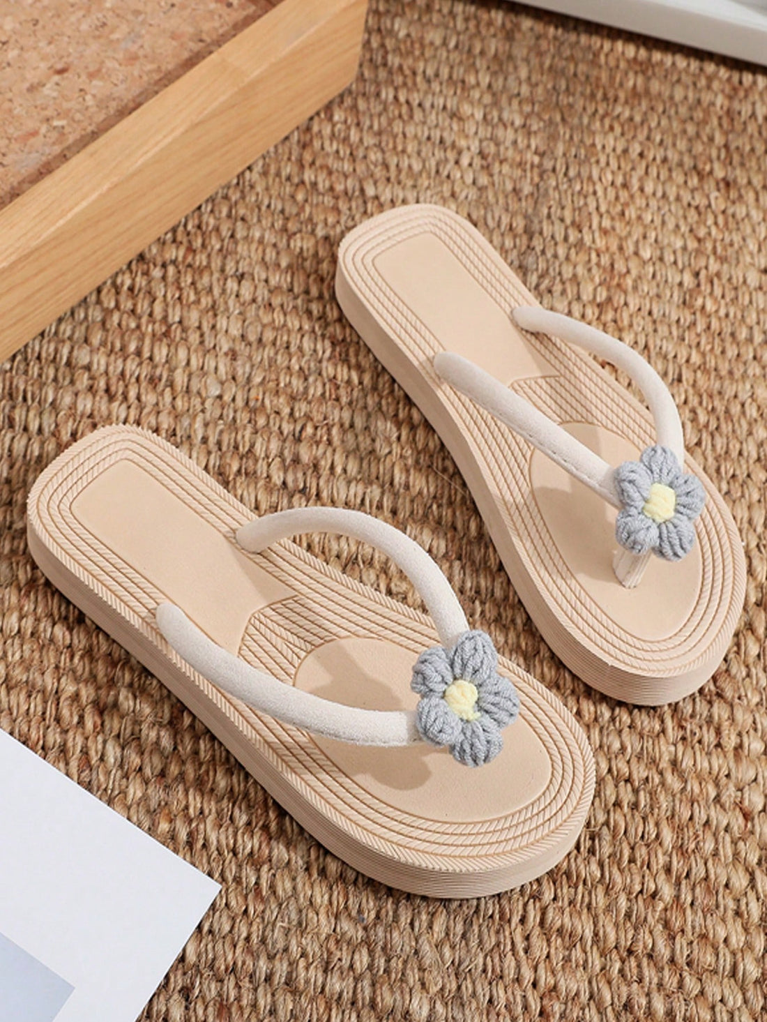 Women's casual flat thong flip flop sandals with minimalist design and applique detail, suitable for outdoor and beach holiday wear.