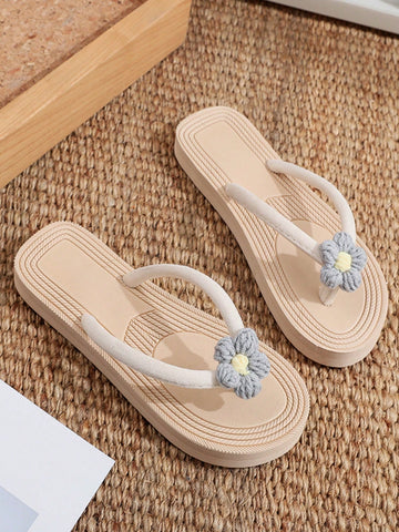 Women's casual flat thong flip flop sandals with minimalist design and applique detail, suitable for outdoor and beach holiday wear.