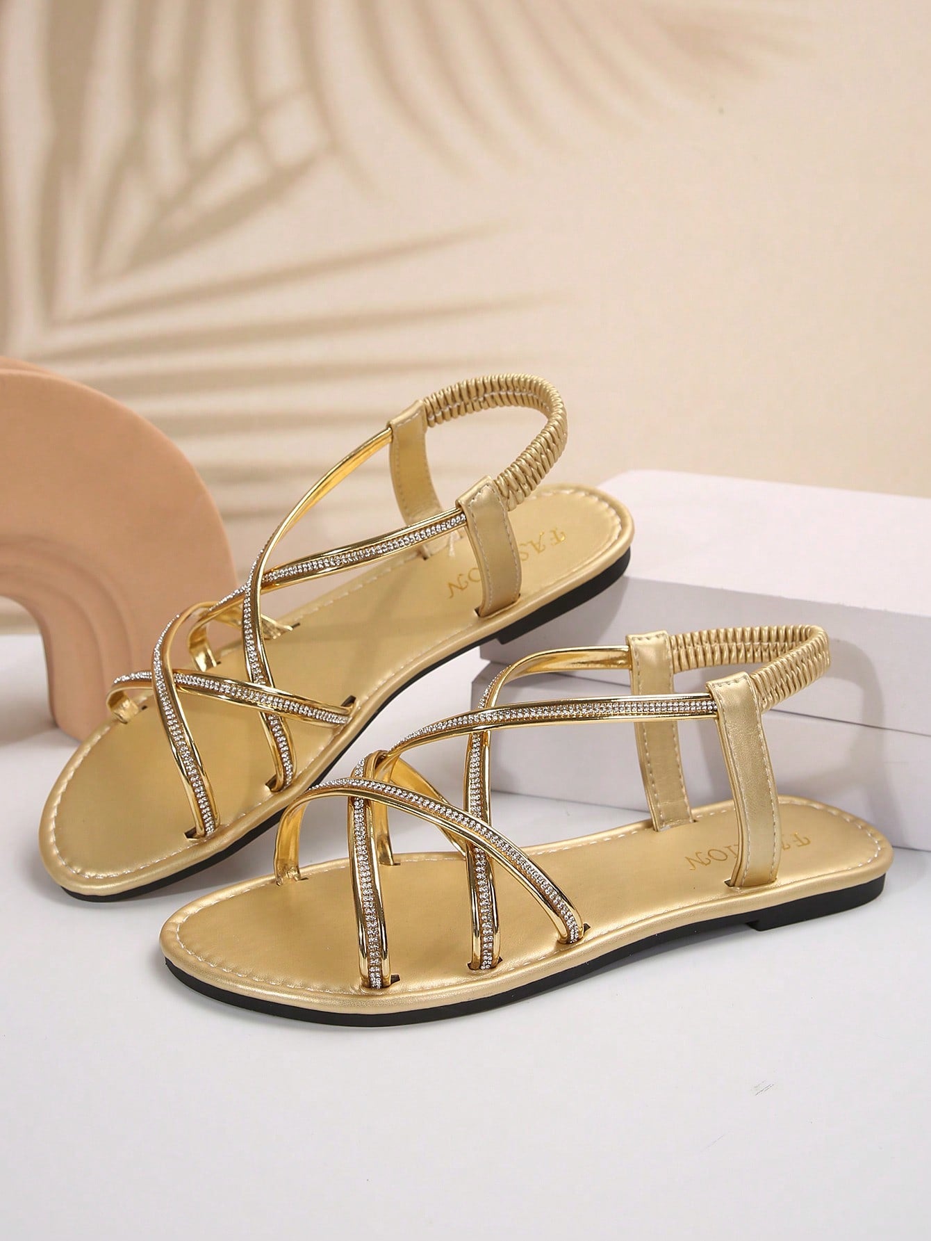 Women's plus size flat slide sandals with open toe, cross straps, rhinestone embellishment, and elastic band detail, suitable for casual beach and outdoor summer wear.