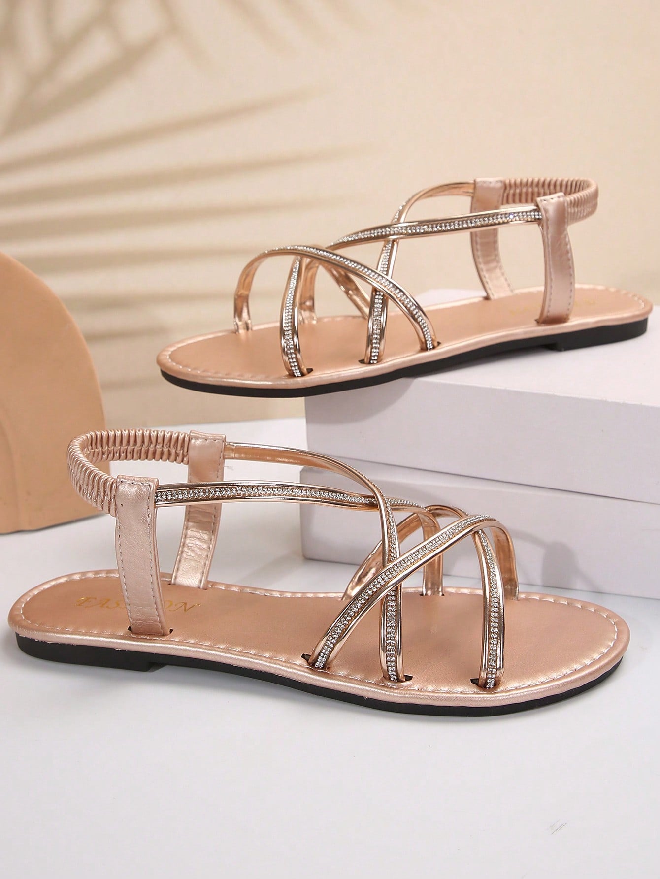 Women's plus size flat slide sandals with open toe, cross straps, rhinestone embellishment, and elastic band detail, suitable for casual beach and outdoor summer wear.