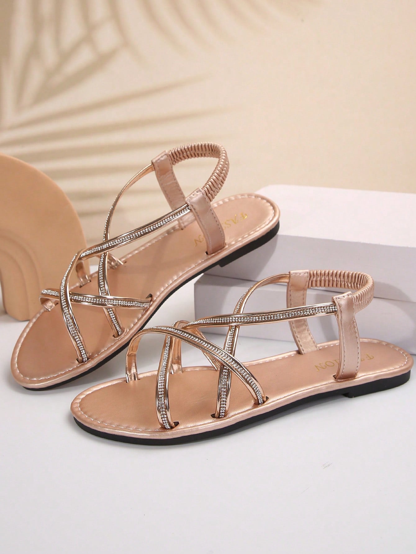 Women's plus size flat slide sandals with open toe, cross straps, rhinestone embellishment, and elastic band detail, suitable for casual beach and outdoor summer wear.
