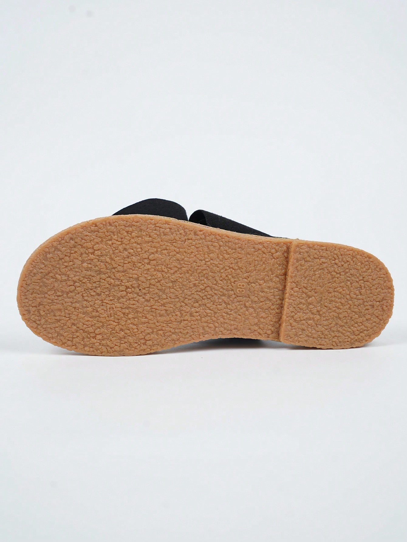 Women's flat slide sandals with bow tie, knot, and braided details, toe post design, and bohemian plant pattern.